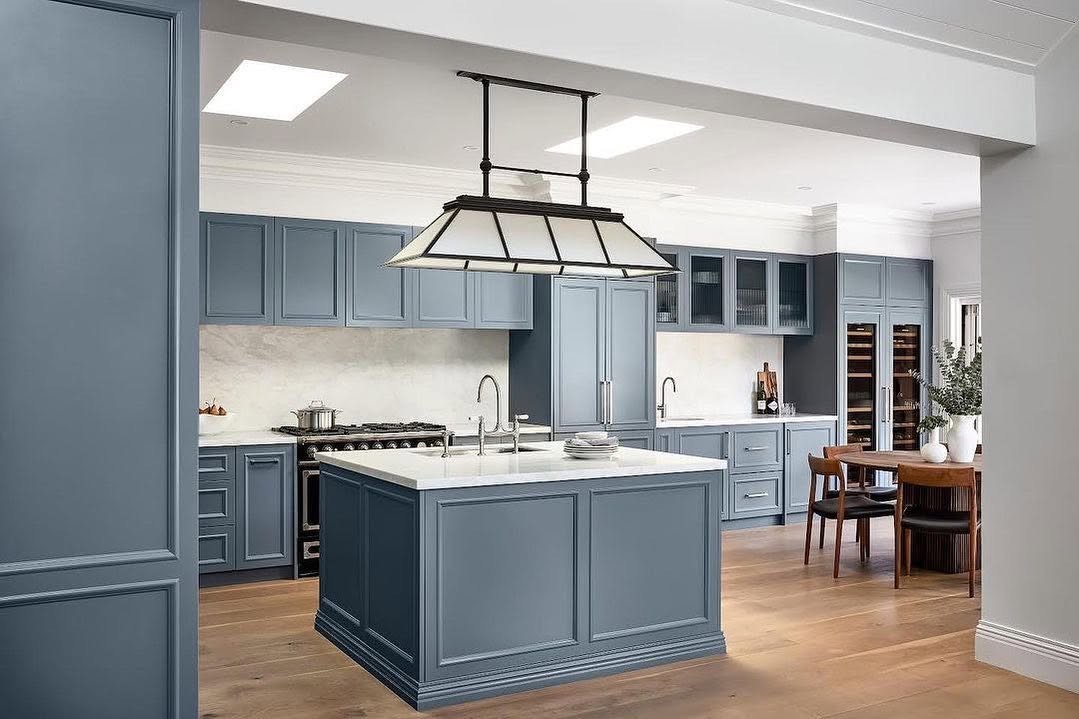 Hamptons-style blue-grey kitchen with light oak flooring